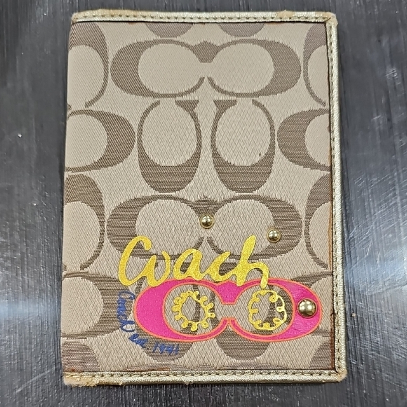 Coach Handbags - Coach Tan Signature Canvas Passport Holder with Pink & Yellow Logo